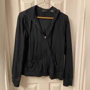 Black, cotton jacket. 100% cotton. Zip front and has pockets.